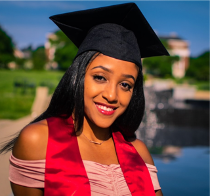 Young woman in a collegiate graduate style headshot