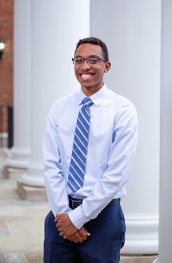 Young man in a dress shirt and blue tie
