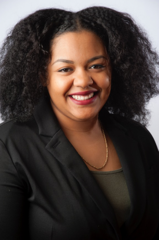 Young woman in black suit